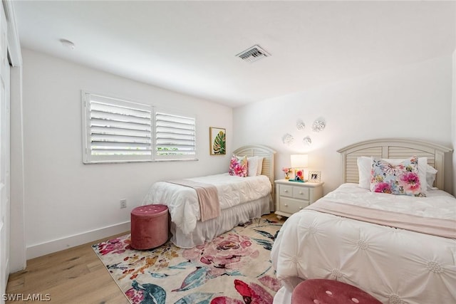 bedroom with light wood-type flooring