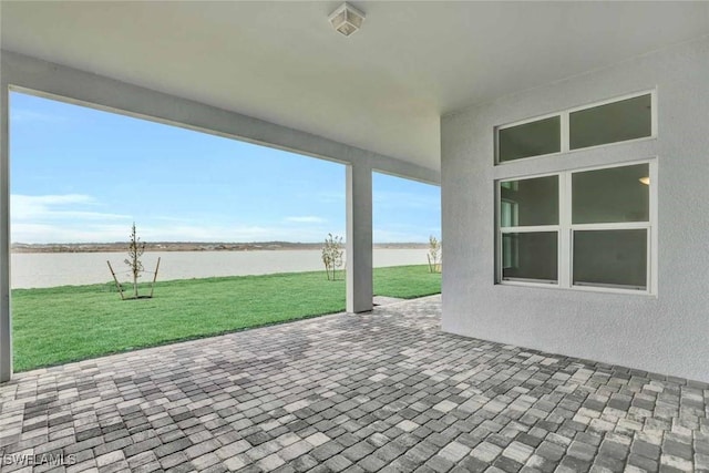 view of patio / terrace featuring a water view