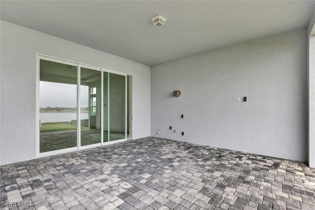 view of patio featuring a water view