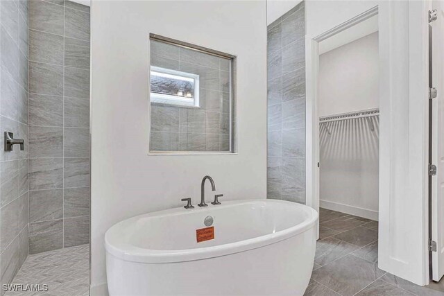 bathroom with separate shower and tub