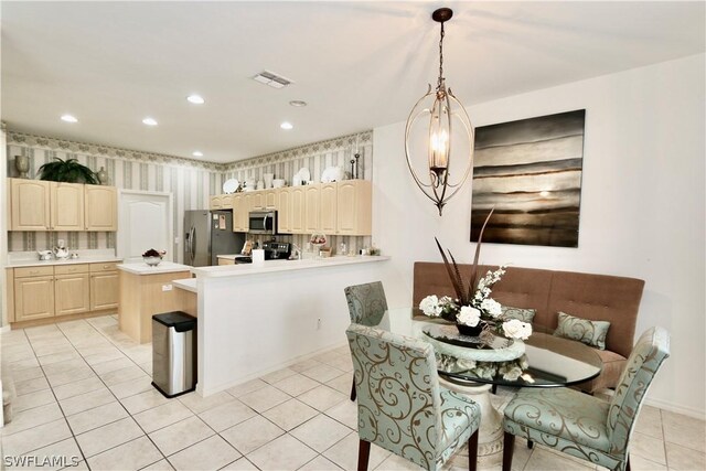 dining room featuring light tile floors