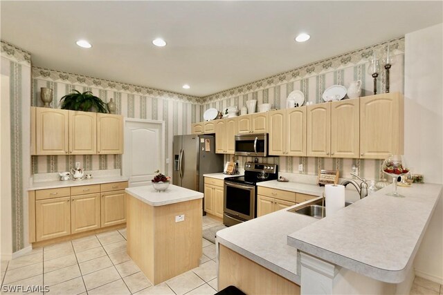 kitchen featuring light brown cabinets, light tile flooring, backsplash, a center island, and appliances with stainless steel finishes