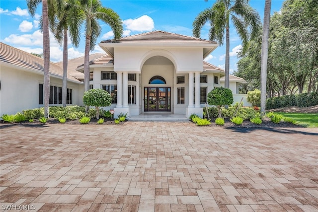 view of exterior entry featuring french doors