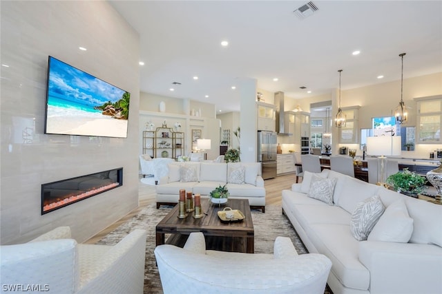 living room with a fireplace and hardwood / wood-style flooring