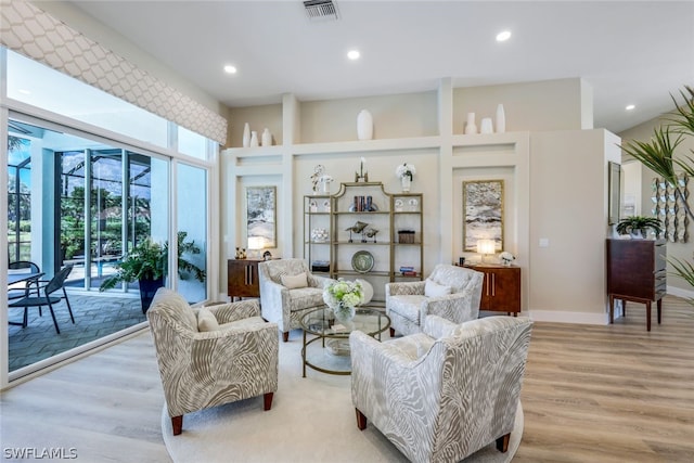 sitting room featuring light hardwood / wood-style floors