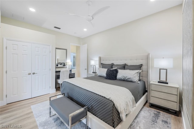 bedroom with ceiling fan, a closet, and light wood-type flooring