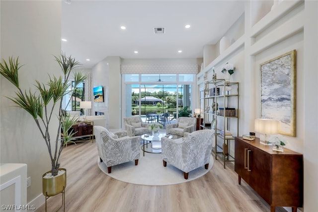 living room with light hardwood / wood-style flooring