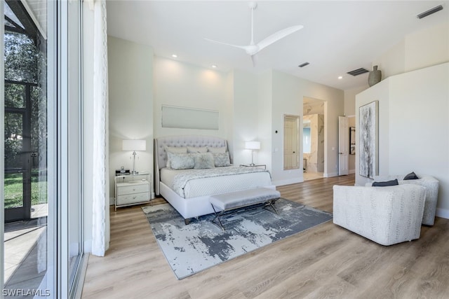 bedroom featuring access to exterior, light wood-type flooring, multiple windows, and ceiling fan