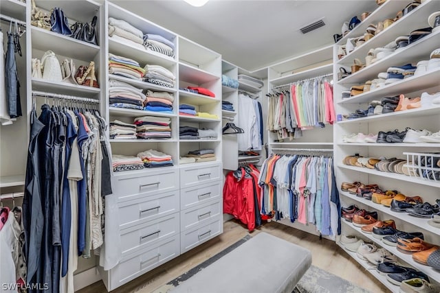 walk in closet featuring light wood-type flooring