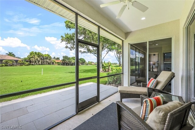 sunroom with ceiling fan