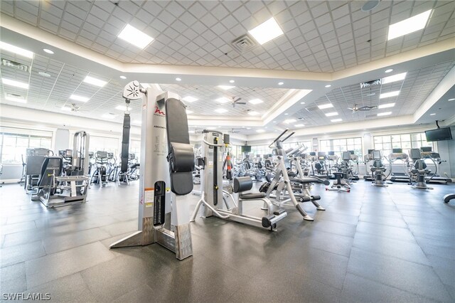 gym with a raised ceiling