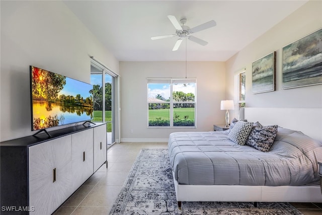 bedroom featuring light tile patterned floors, access to outside, baseboards, and ceiling fan