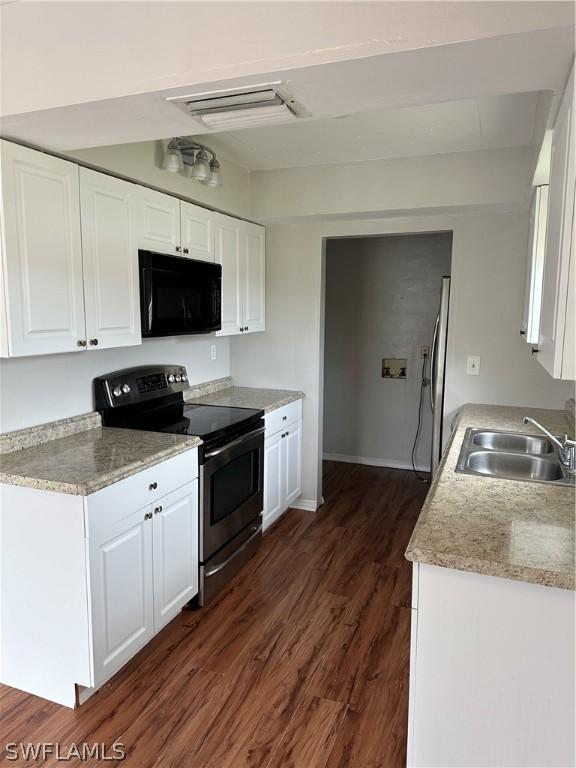 kitchen featuring stainless steel appliances, white cabinets, dark hardwood / wood-style floors, and sink