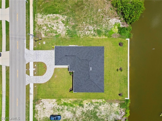 birds eye view of property featuring a water view