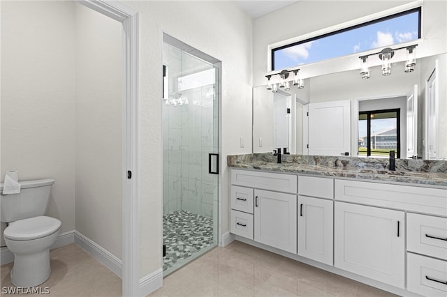 bathroom featuring vanity, toilet, tile patterned floors, and an enclosed shower