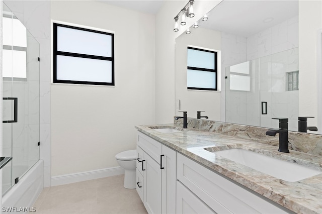 full bathroom with enclosed tub / shower combo, tile patterned floors, toilet, and vanity