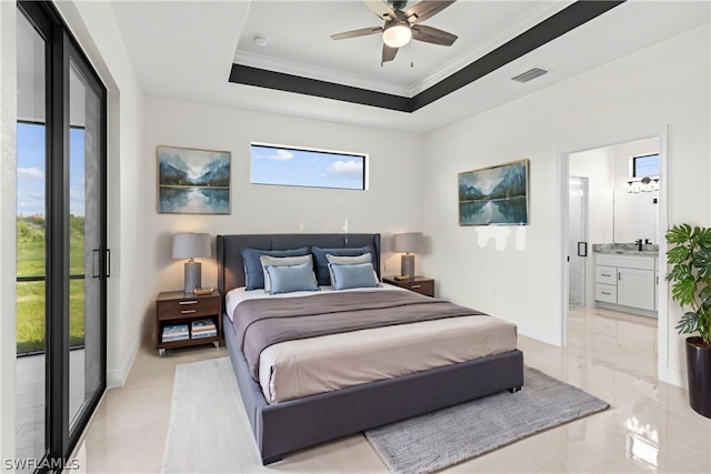 bedroom with crown molding, ensuite bath, access to outside, ceiling fan, and a tray ceiling