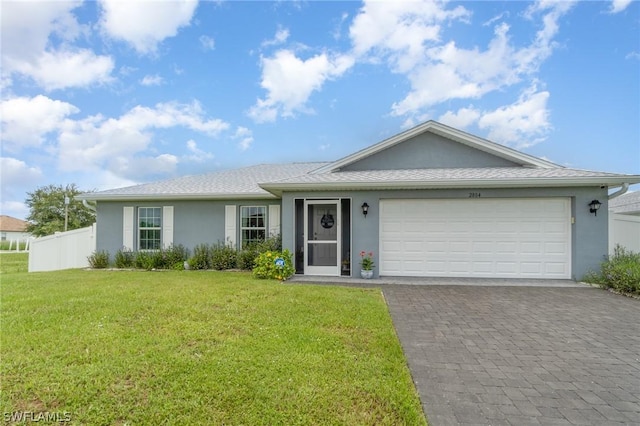 ranch-style home with a garage and a front lawn