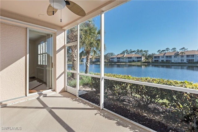 unfurnished sunroom with a water view