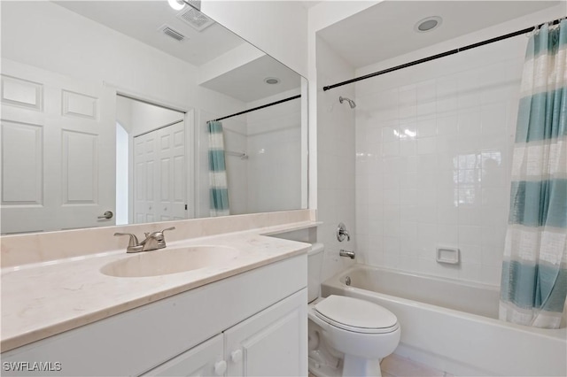 full bathroom featuring shower / bath combo, vanity, and toilet