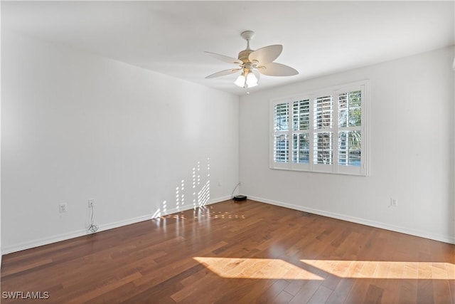 empty room featuring hardwood / wood-style flooring and ceiling fan