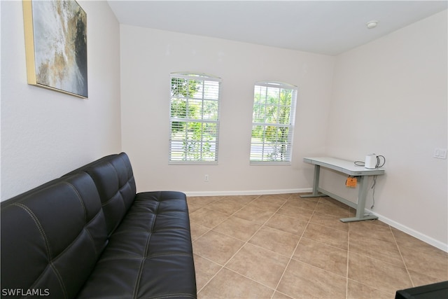 sitting room featuring light tile patterned floors