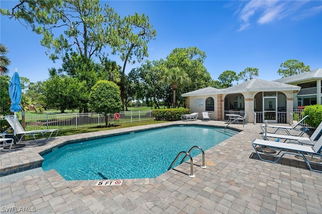 view of pool featuring a patio