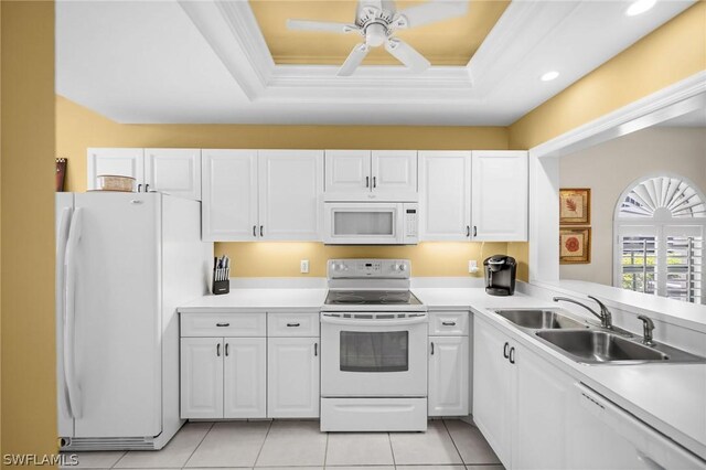 kitchen featuring white cabinets, white appliances, and sink