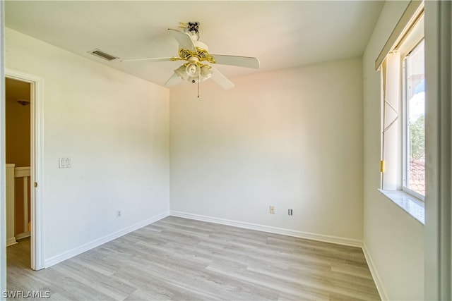 unfurnished room with ceiling fan and light wood-type flooring