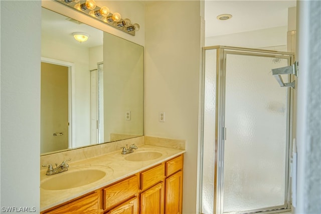 bathroom with vanity and walk in shower