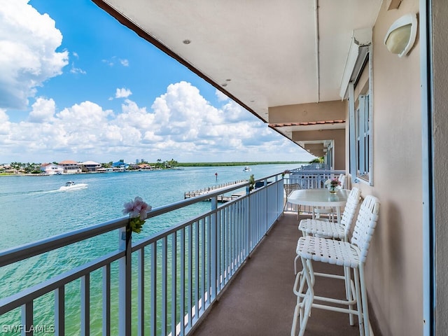 balcony featuring a water view