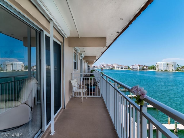 balcony featuring a water view