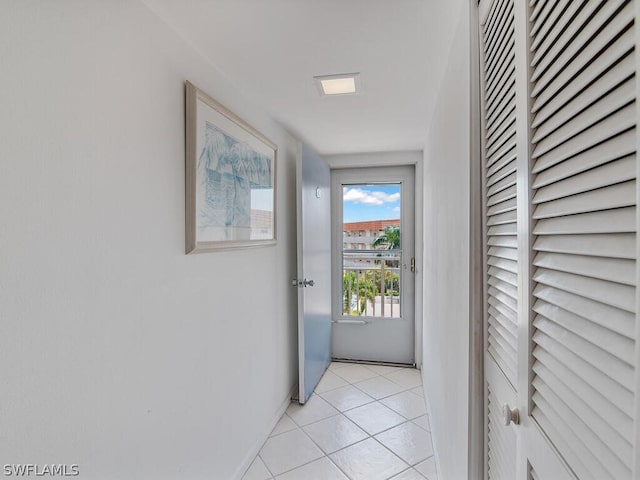 doorway featuring light tile patterned floors