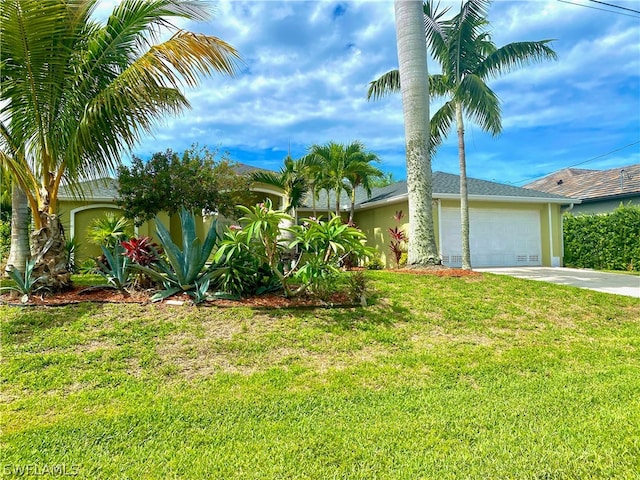 view of front of house featuring a garage and a front yard