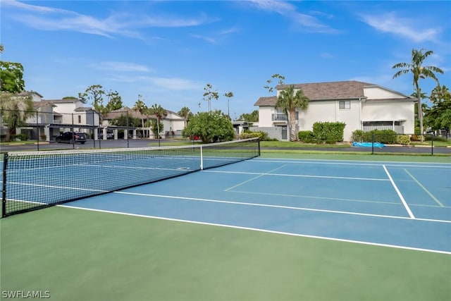 view of sport court featuring fence