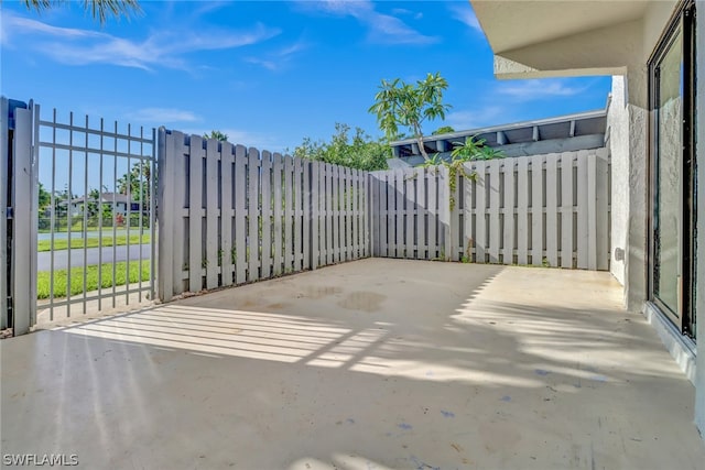 view of patio featuring fence