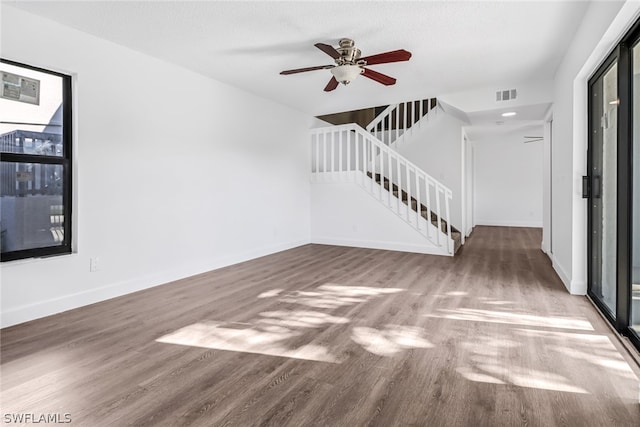 interior space with ceiling fan and hardwood / wood-style floors