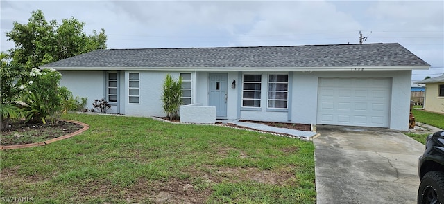 single story home with a garage and a front lawn