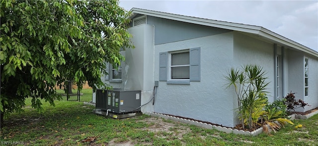 view of home's exterior with central air condition unit