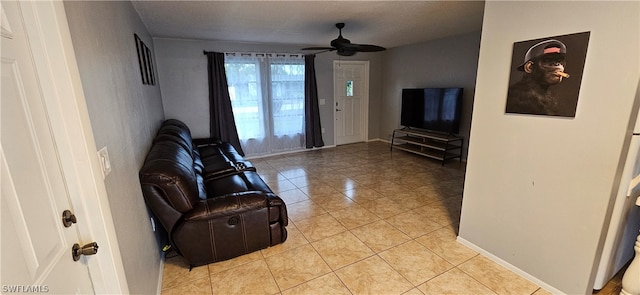 tiled living room featuring ceiling fan