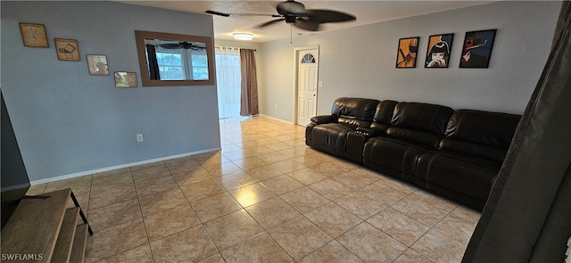 tiled living room with ceiling fan