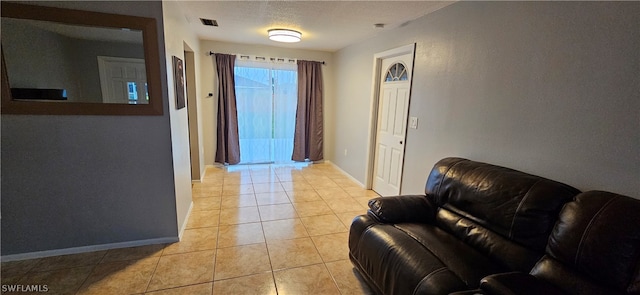 hallway featuring light tile floors