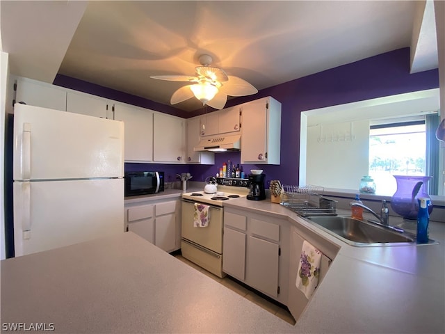 kitchen featuring ceiling fan, sink, white appliances, and white cabinets