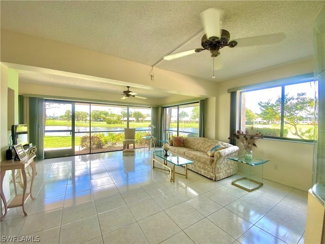 unfurnished sunroom with a ceiling fan