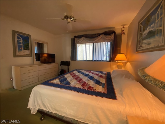 bedroom featuring ceiling fan and carpet