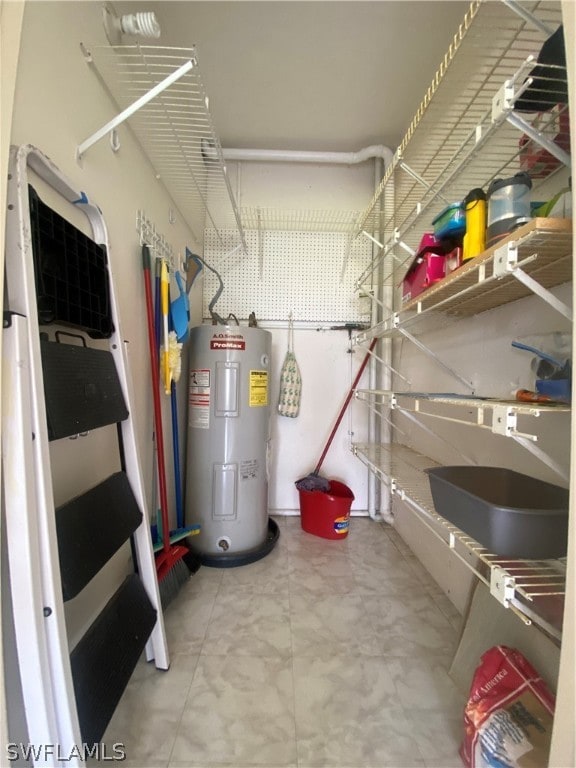 utility room with electric water heater