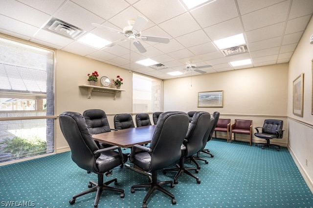 office featuring ceiling fan, a drop ceiling, and carpet floors