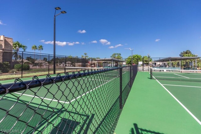 view of sport court with fence