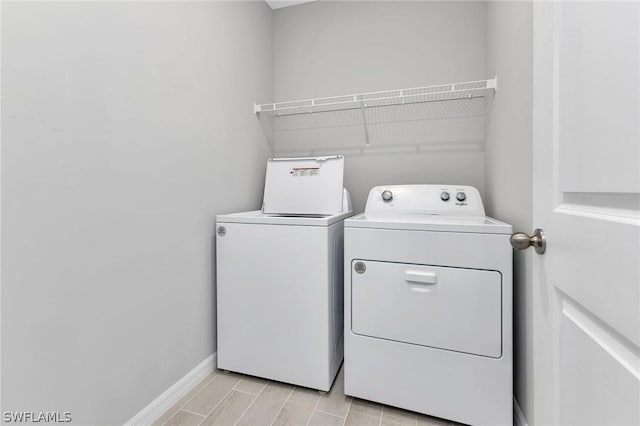 washroom with independent washer and dryer