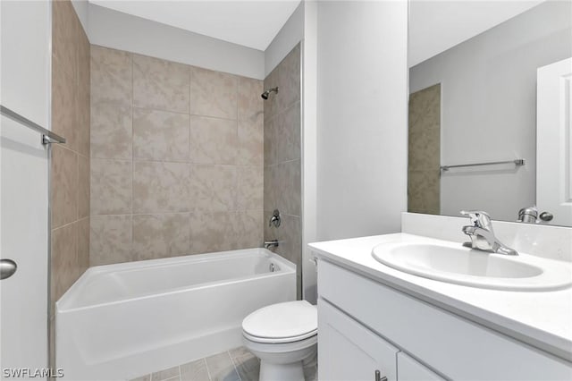 full bathroom with vanity, tiled shower / bath combo, and toilet